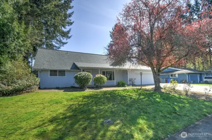 Brand new roof, covered front porch  and mature landscaping add quintessential charm and lovely curb appeal to this solid home.