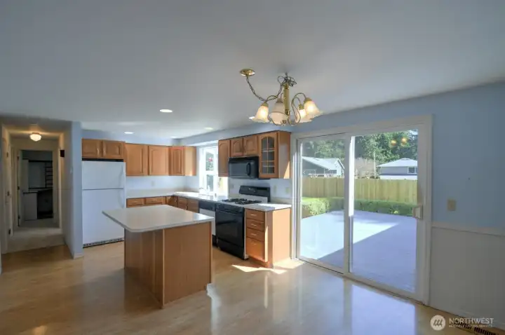 Off of the kitchen are sliding doors to the back deck