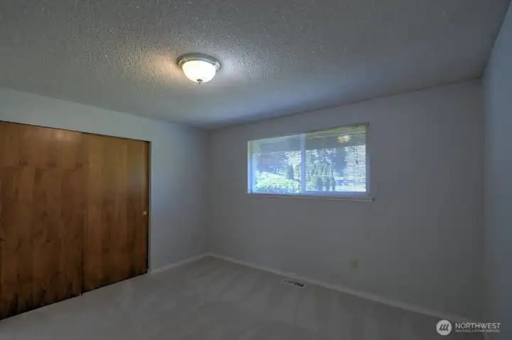 Main floor bedroom facing the front of the house
