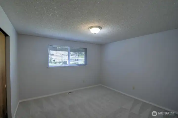 Another view of the front-facing main floor bedroom