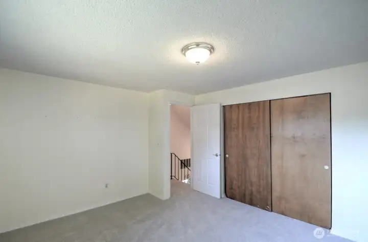 Upstairs bedroom located to the left of the stairway