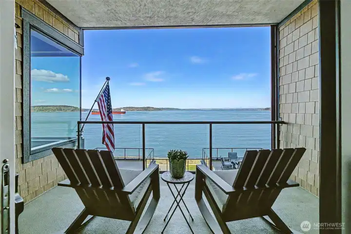 Sweeping views of Commencement Bay and Vashon Island set the tone for this exceptional 6th-floor waterfront residence.
