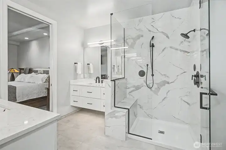 Walk-in shower and heated floors complete the spa-like experience of the primary bath.