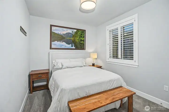 Additional bedroom offers versatility for guests, work, or relaxation.