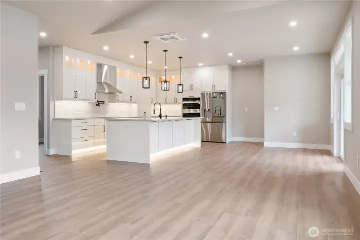 Open concept layout from living room to kitchen