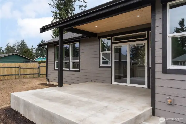 Covered patio with concrete pad — ready for outdoor entertaining