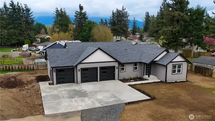 Front exterior aerial angle showing driveway and lot size