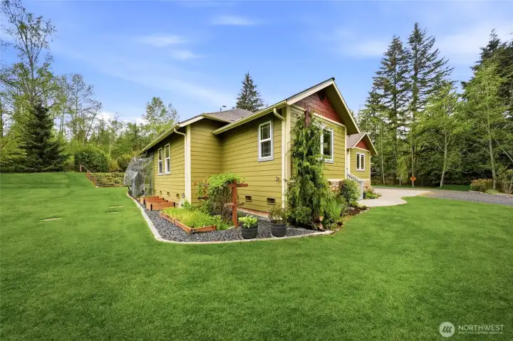 Well-maintained exterior with mature landscaping.