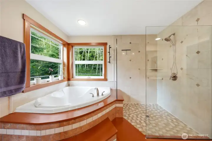 5-piece bath with dual vanity, soaking tub, and shower.