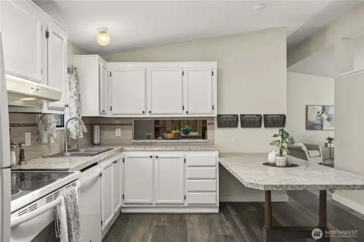 Kitchen flows to the dining room and living room