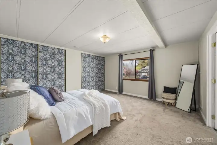 Primary bedroom has 2 custom closets and is opposite of the other two bedrooms.