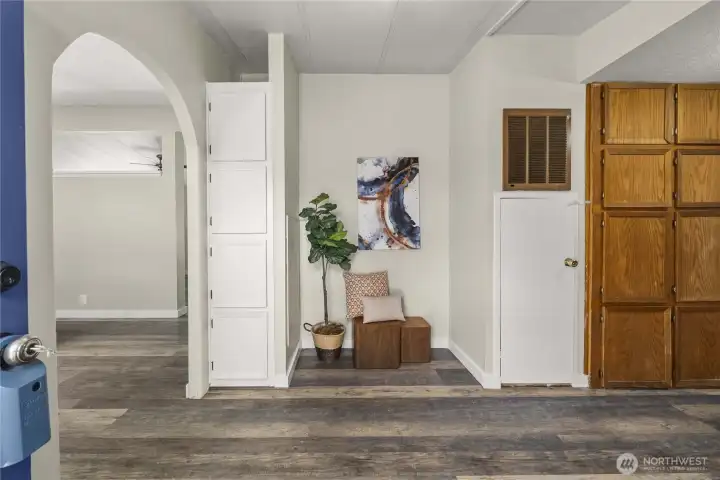 Back door entry with space for a freezer or seating area, storage and laundry room