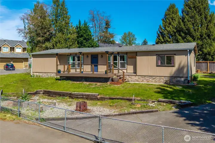 Large one level fully fenced home on a .35 ac lot with rolling gate