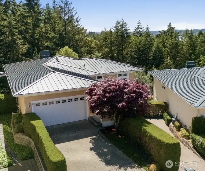 Beautiful one-story condo with garage, separate entrance & deck with views.