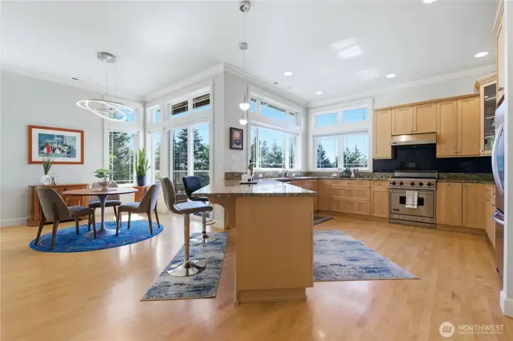 Open concept kitchen, dining and living room with large deck