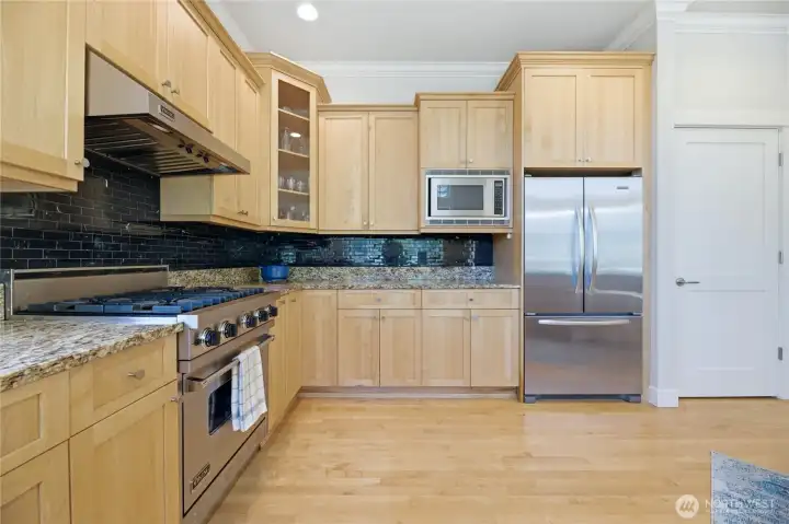 There is SO much counter space, cabinetry and storage in this gourmet kitchen