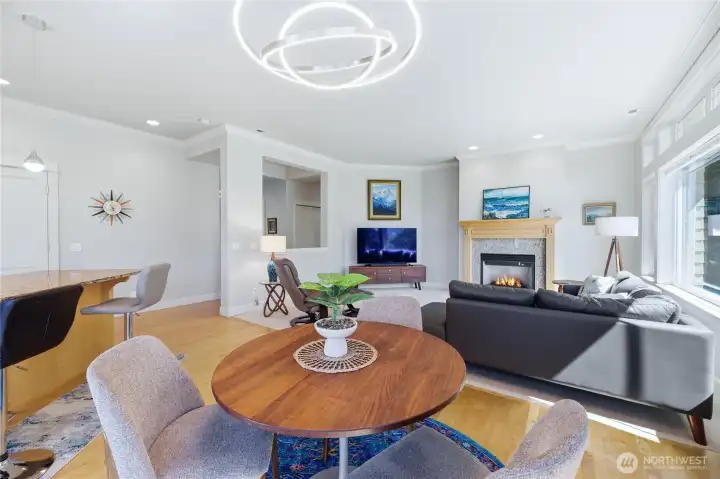 Dining room looks out to spacious living room with gas fireplace