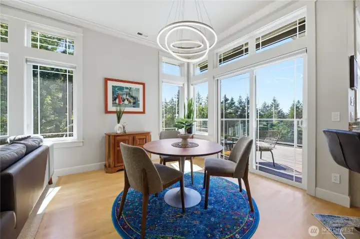Spacious dining with floor to ceiling windows to enjoy the natural beauty of the Pacific NW