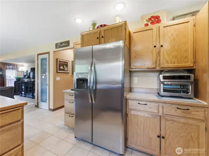 Kitchen with updated appliances and open to the dining area and casual living area with two pantries for all of your kitchen supplies Kitchen with updated appliances and open to the dining area and casual living area with two pantries for all of your kitchen supplies