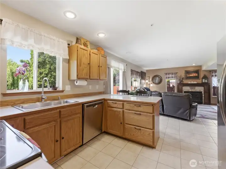 Plenty of countertop space open to the casual living room area with countertop seating Plenty of countertop space open to the casual living room area with countertop seating