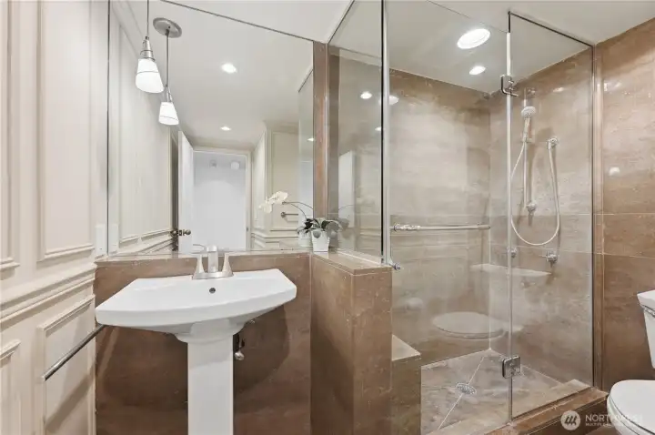 Beautiful marble guest shower. Beautiful marble guest shower.