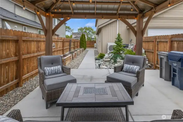 Such a nice outdoor area with concrete patio, sidewalk to the dining room.