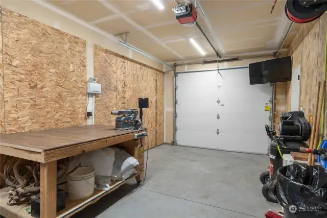 1 side of the 3 car garage is heated for your hobby space or workshop, or take the wall out & just have it open to the rest of the 2 car garage.