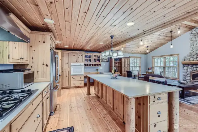 Beyond the end of the 4x10 foot island is a built-in desk, storage cabinets and a pantry.