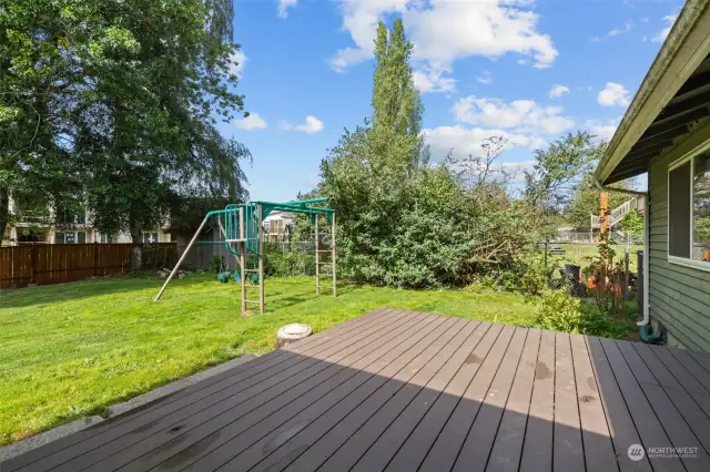 The open layout and large yard make this home perfect for hosting summer BBQs and gatherings.