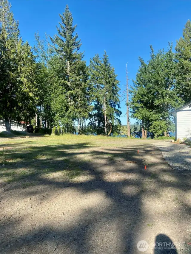 Subject property is to the left of the orange markers.