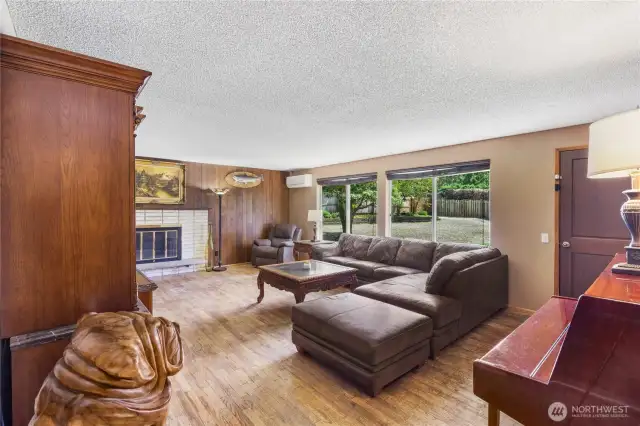 living room with beautiful view of back yard