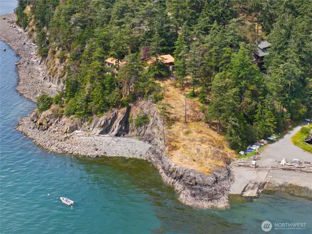You walk down the point to get to the beach at Cook's Cove with it's boat launch.  People stash kayaks & rowboats down there.  There's picnic tables, too. You could have your own mooring buoy in front of your house.