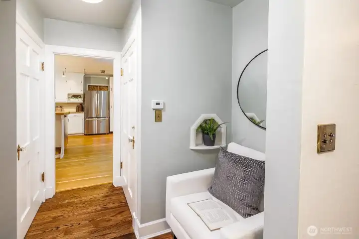 Sweet reading nook or storage area across from main floor powder room.  Notice cute built in telephone cubby.