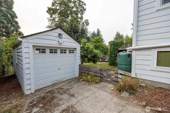 One car secure garage PLUS lots of off street parking.  Garage has it's own new electrical panel.