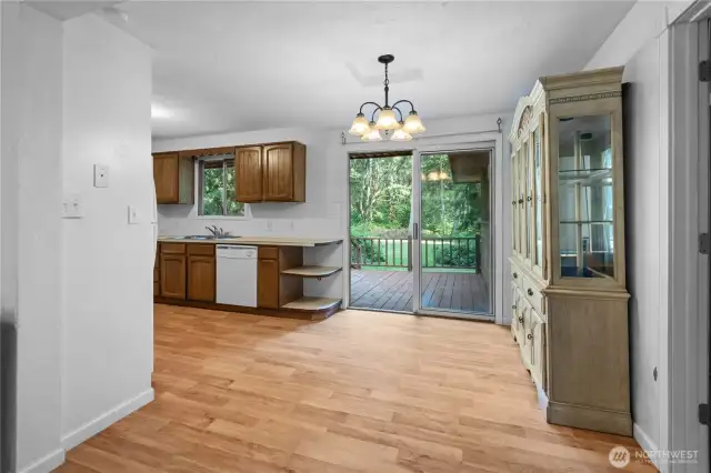 The dining area features easy access to the kitchen and to the back porch, making a great layout for casual meals or large events.
