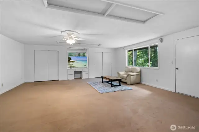 The great room offers plenty of possibilities for your uses and layouts, and features dual closets for storage and built in desk area.