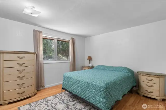 The primary bedroom is spacious and bright.