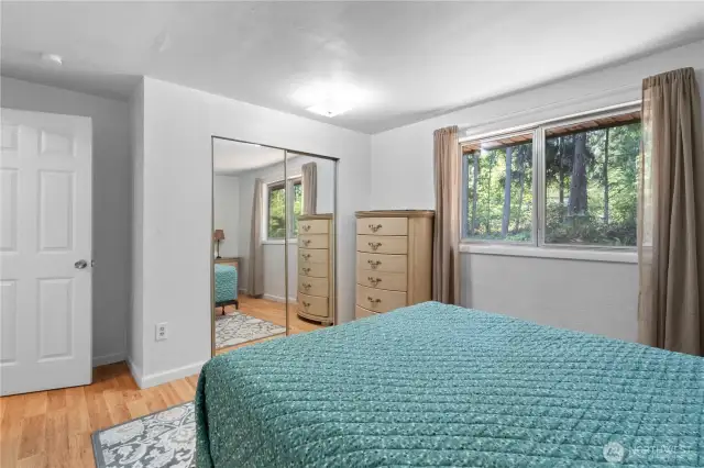 The closet includes full size mirrored sliding doors.