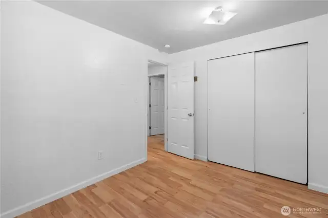 The additional bedroom features a closet with dual sliding doors and plenty of space.