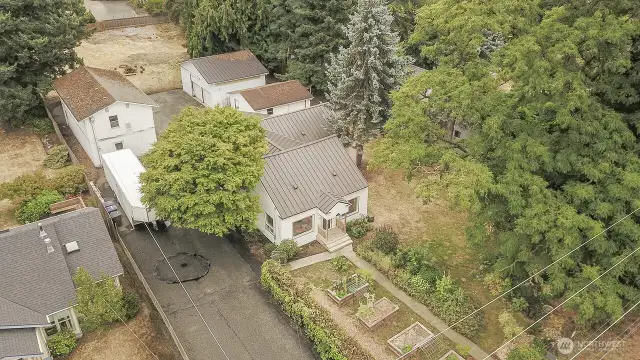 Opportunity is knocking! 29,500 sq ft lot just re-zoned R3. This property has ton of possibilities.