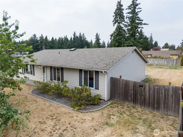 The east side of the home shows where you can access the back yard. You can even store an RV, boat along this part of the property if you like.