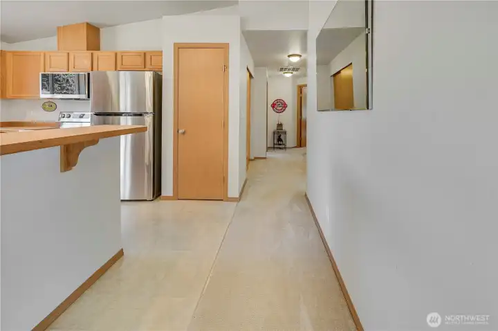 This well-laid out rambler has two guest bedrooms down the hall to the right, and a primary ensuite down the hall on the left.