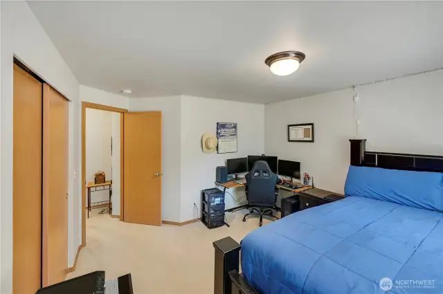 The second guest bedroom currently houses a King size bed and a working desk.