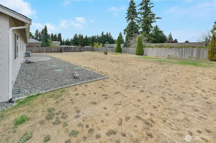 This shy 1/3 acre property is mostly flat and ready for your backyard enjoyment.  The far back corner is the drain field, and to the right there is underground power run to the corner for a potential second garage or shop.