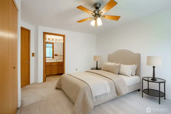 Virtually Staged: Primary Bedroom with attached full bathroom.