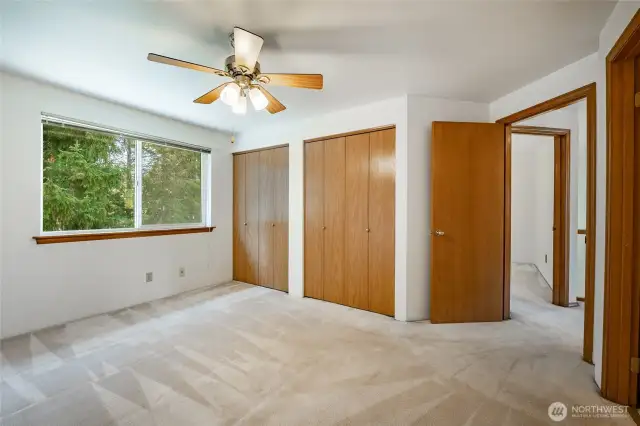Upstairs Primary bedroom with double closets and en-suite.