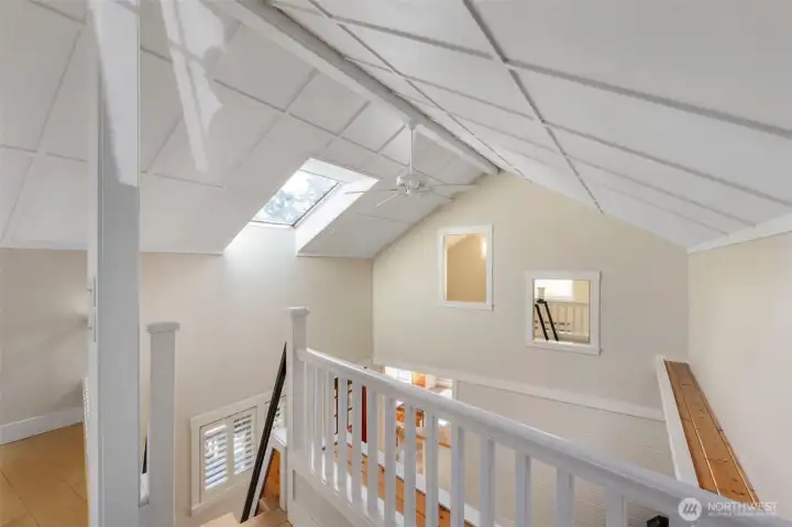 From upstairs bonus room looking over the living room area across to the guest room.