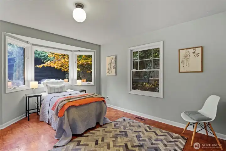 Main floor bedroom with big bay window.