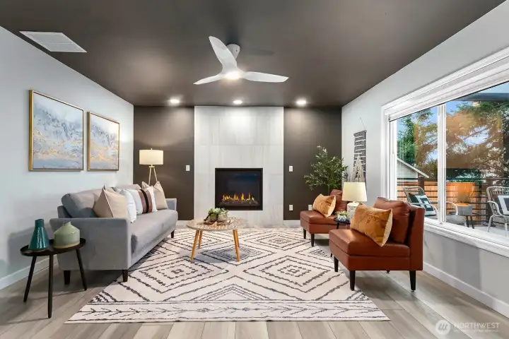 Newly installed fireplace with elegant floor-to-ceiling marble tile surround.
