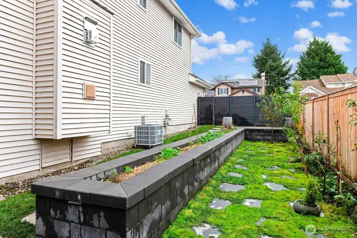 Custom designed raised planter bed and five varieties of fruit trees to bring your gardening dreams to life.